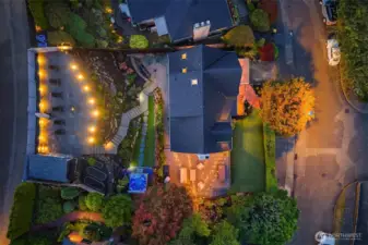 Gorgeous street to alley lot with custom lighting.  Can you find the hot tub?!?