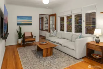 Bonus room on main level with wall of gorgeous leaded windows