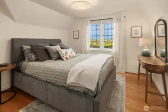 Second bedroom on upper level with city views