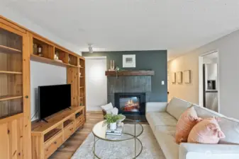 New tile surround and mantle on fireplace.