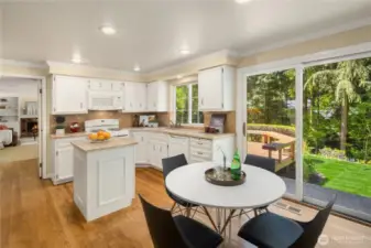 Bright kitchen with hardwood floors.