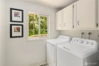 Laundry room located next to the kitchen.