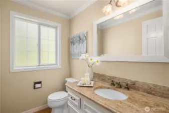 Large powder room off kitchen.