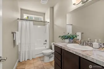 Full bath is between the 2 downstairs bedrooms.