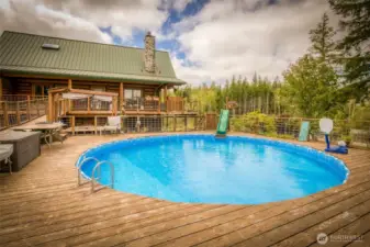 26 ft pool w/ sand filter.  Seating, cubbies and full surrounding deck