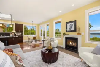 Cozy living room off of kitchen with gas fireplace.