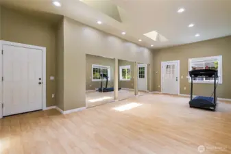 Bonus room attached to the garage. Possible mother-in-law suite or ADU with its own entry door. Not in the photo is the other wall with multiple closet space.