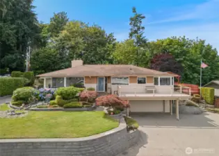 A cherished home offering a lifestyle rooted in heritage and decades of memories. The expansive deck is perfect for enjoying morning coffee while watching the sun rise over Mt. Rainier.