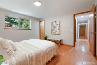 Another view from the primary bedroom with door to a private bathroom.