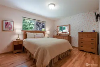 A third bedroom is a nice size and enjoys the same beautiful hardwood flooring this home exudes.