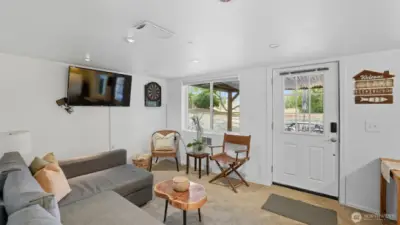 Comfortable living space that doubles as a game room or media area.