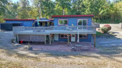 Nestled against a natural backdrop, this home offers privacy and tranquility.