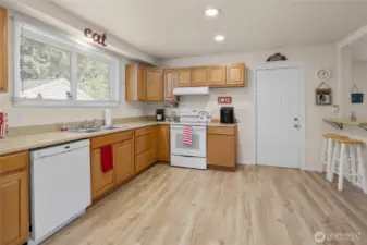 Kitchen with door leading to the covered side area.