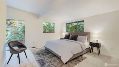 Wake up surrounded by nature in this peaceful primary suite.