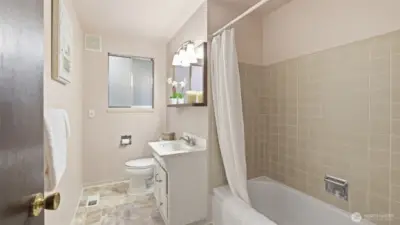 Bright and functional guest bath with a full tub/shower combo.