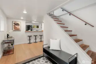 Stairs from the daylight basement take you past a full bathroom up to 2 bedrooms