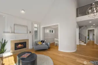 Living room opens into dining room. yes, that is a rounded wall