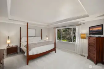 Primary bedroom with greenbelt views, new carpeting throughout the upstairs