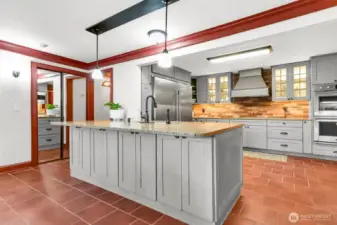Tastefully redone kitchen with island is the centerpiece of the home.