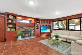 Large family room with built in shelving and TV.