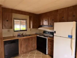 Open concept kitchen view from family room.  Bring your ideas and updating strategies to make this 3 bed shine again