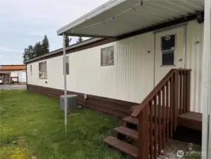 covered Side entry way Ac unit connected to whole house central heating system