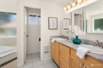 Water closet and newer granite countertops.