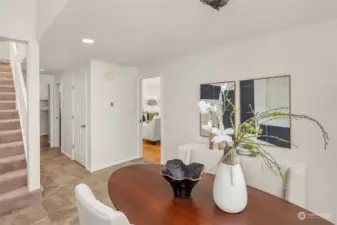 Hallway leads to the laundry, half bath and to the basement.