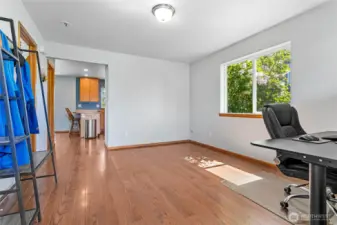 Step into this freshly painted flex space—currently set up as a home office, but easily adaptable as a cozy second living room, creative studio, or play area.