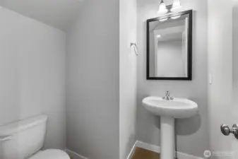 Main floor half bath     Photos of a finished home in same community