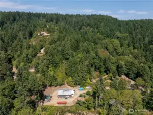 Rare South facing acreage - split into seven 5-acre parcels with shop, woodshed, gardens, sawmill, cabins, and campsites. Not to mention Hood Canal Views from SO many spots!