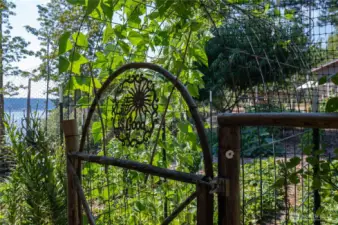 Hand-crafted features throughout the property, including the garden gates and arches.