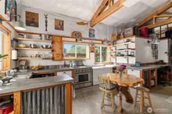 This is the 'canning kitchen' and has concrete countertops and durable appliances, plus a large desk to get your office work done with the high speed Starlink internet.