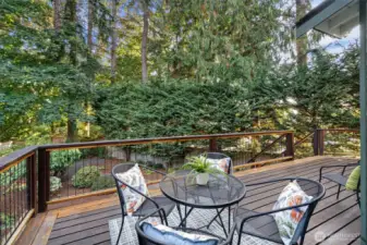 The private, secluded backyard features deck perfect for entertaining and hot tub for relaxing!