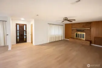 Main entrance. Spanning 1,446 sq ft., the home features a large living room flowing seamlessly into a formal dining room.