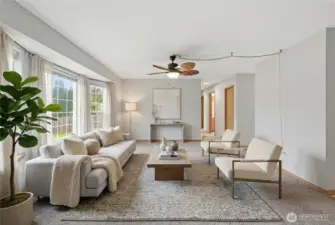 Virtually staged. Bright, welcoming living room with a comfortable, easy-flow layout.