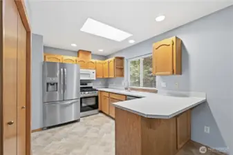 Well-kept kitchen with plenty of cabinet and counter space.