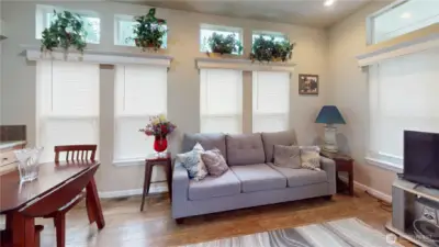 Laminate wood flooring throughout, lots of natural lighting, forced air heat and free standing air conditioning unit to keep the home cool in the summer.