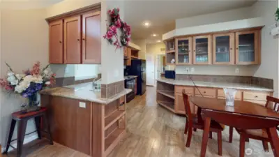 The dining room features display cabinets and plenty of counter and storage space.