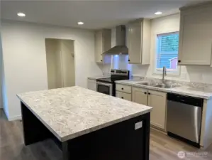 View of kitchen island with eating space.