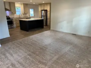 Living room looking into the kitchen.