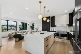 Modern Chef's Kitchen open to the living room and City View