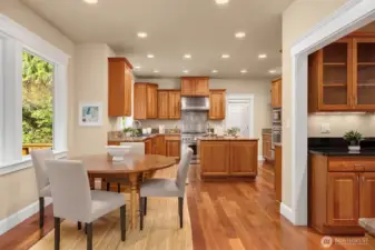 A breakfast nook sits between the family room and kitchen.