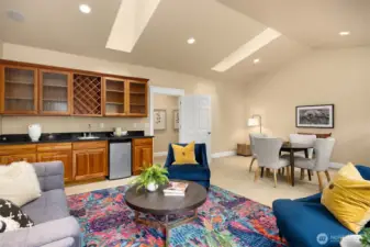 Second floor media/bonus room is fantastic, with vaulted ceilings, skylights, built-in cabinetry, sink and under-counter refrigerator.