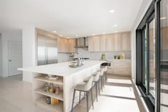 Solid slab granite & backsplash, seating up to 5 at eat-in bar, built in storage around island