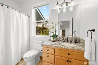 Main level full bath adjacent to main level bedroom.