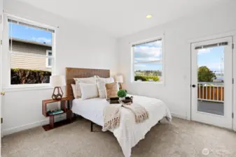 Main floor bedroom lives like guest quarters with a private deck and adjacent full bathroom.