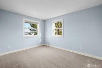 Third upper level bedroom with views.