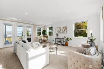 Spacious formal living room with main level entertaining deck access.