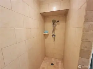 Beautiful tile shower in Master Bathroom.